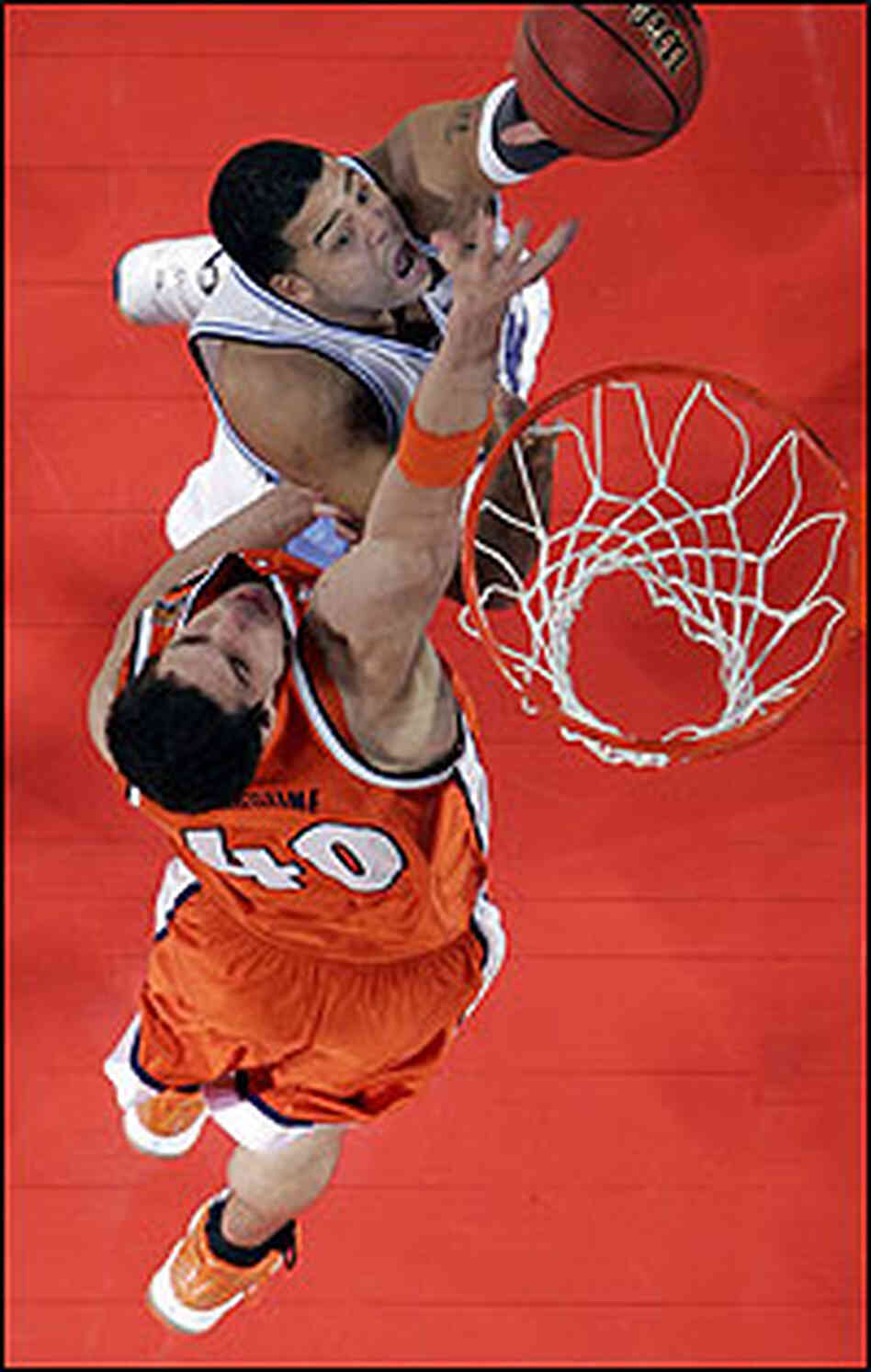 Sean May dunks over Carolina in NCAA basketball title game. Sean May dunks over Carolina in NCAA basketball title game.