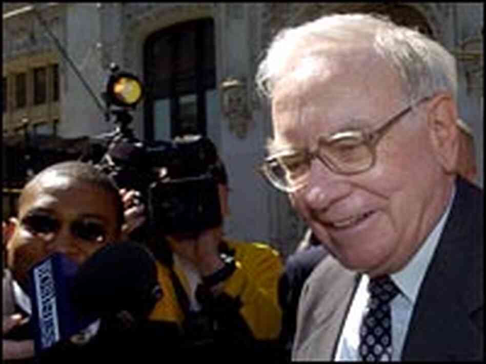 Warren Buffett makes his way through a crush of media. Warren Buffett makes his way through a crush of media.