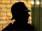Police officer stands outside Bow Street Magistrates Court.