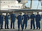 Eileen Collins, commander of of the STS-114 mission, stands with members of the Discovery crew as s Eileen Collins, commander of of the STS-114 mission, stands with members of the Discovery crew as s