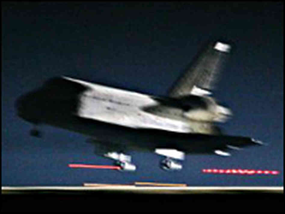 The Space Shuttle Discovery touches down at Edwards Air Force Base in California. The Space Shuttle Discovery touches down at Edwards Air Force Base in California.