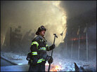 A firefighter stands in the smoking ruins of the World Trade Center A firefighter stands in the smoking ruins of the World Trade Center