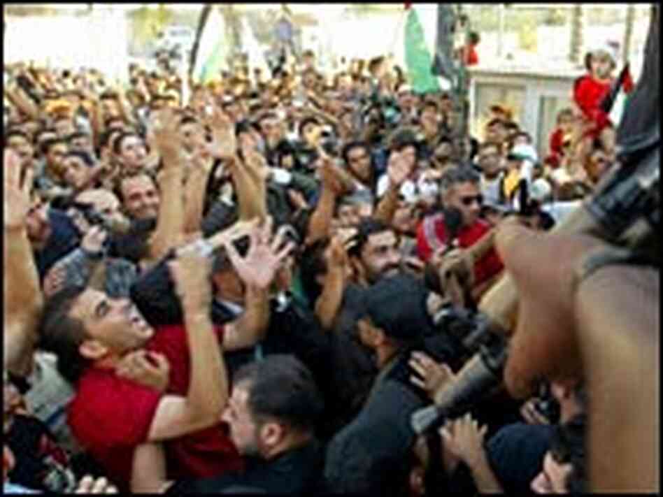 Palestinians celebrate Israel's imminent pullout from the Gaza Strip. Palestinians celebrate Israel's imminent pullout from the Gaza Strip.