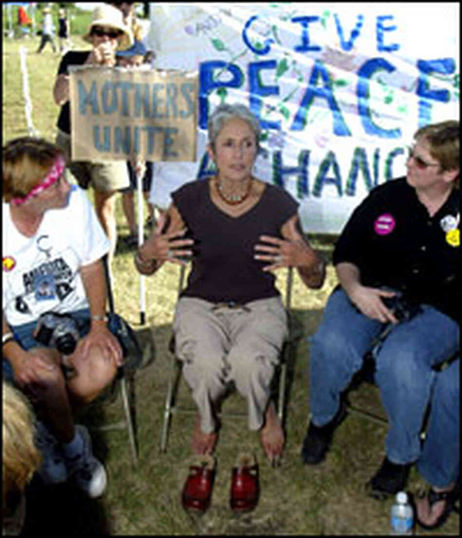 Folk music legend Joan Baez, center, talks to military mothers near President Bush's ranch. Folk music legend Joan Baez, center, talks to military mothers near President Bush's ranch.