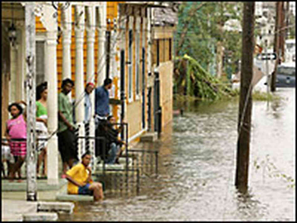 A family waits for the water to recede in New Orleans.
