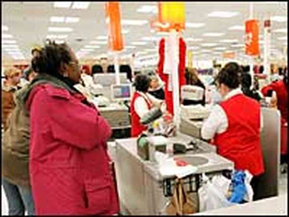 Shoppers pay for purchases at a Kmart in Norridge, Ill., Dec. 19. Shoppers pay for purchases at a Kmart in Norridge, Ill., Dec. 19.