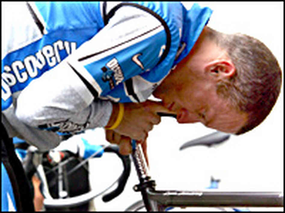 Discovery Channel team rider Armstrong of the U.S. inspects his bicycle as he trains near Grenoble. Discovery Channel team rider Armstrong of the U.S. inspects his bicycle as he trains near Grenoble.