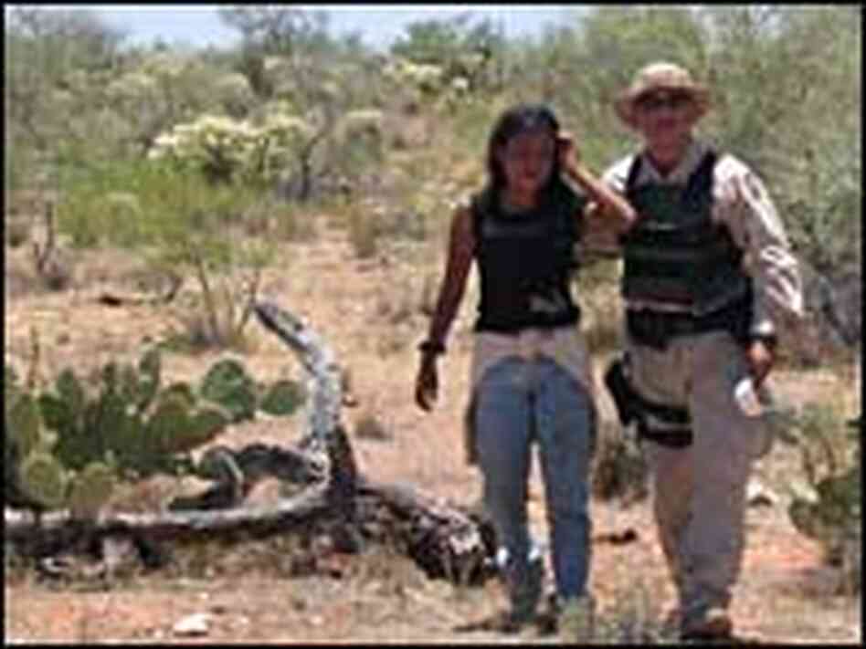 BORSTAR agent Paul McKenna leads an illegal immigrant out of the southern Arizona Desert. BORSTAR agent Paul McKenna leads an illegal immigrant out of the southern Arizona Desert.