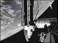 A view of the shuttle docking with the international space station. A view of the shuttle docking with the international space station.