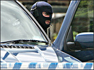 Special Services officer gets out of a vehicle near the Peabody estate in west London.