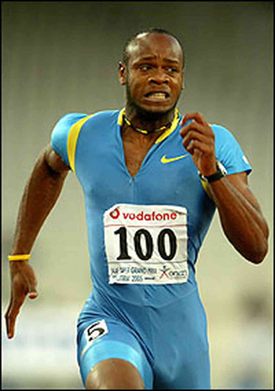 Asafa Powell in full stride during record-breaking sprint. Asafa Powell in full stride during record-breaking sprint.