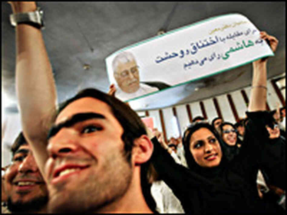 Iranian students hold banners and shout slogans in support of Akbar Hashemi Rafsanjani. Iranian students hold banners and shout slogans in support of Akbar Hashemi Rafsanjani.