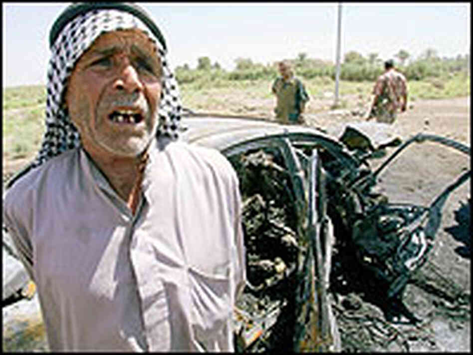 A relative of Dhari Ali al-Fayadh at the scene of the Iraqi politician's murder. A relative of Dhari Ali al-Fayadh at the scene of the Iraqi politician's murder.