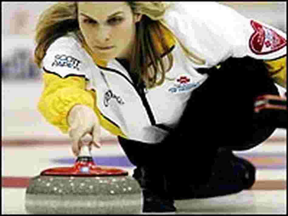Jennifer Jones throws a rock during the competition. Jennifer Jones throws a rock during the competition.