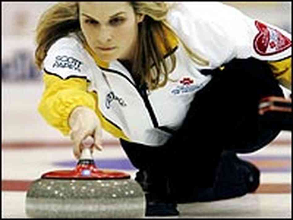 Jennifer Jones throws a rock during the competition. Jennifer Jones throws a rock during the competition.