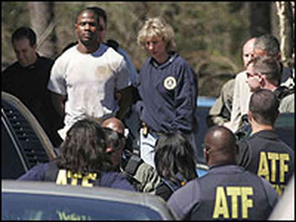 Murder suspect Brian Nichols is escorted from FBI headquarters Saturday. Murder suspect Brian Nichols is escorted from FBI headquarters Saturday.