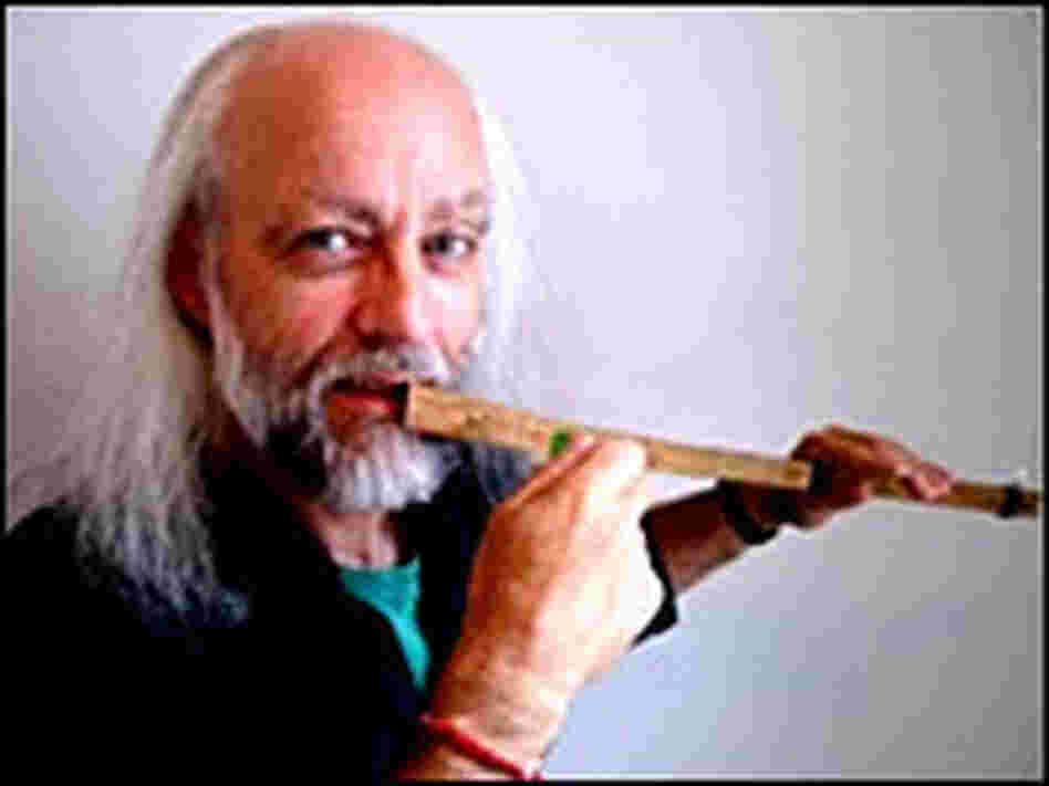 John Palmes demonstrates his mouthbow.
