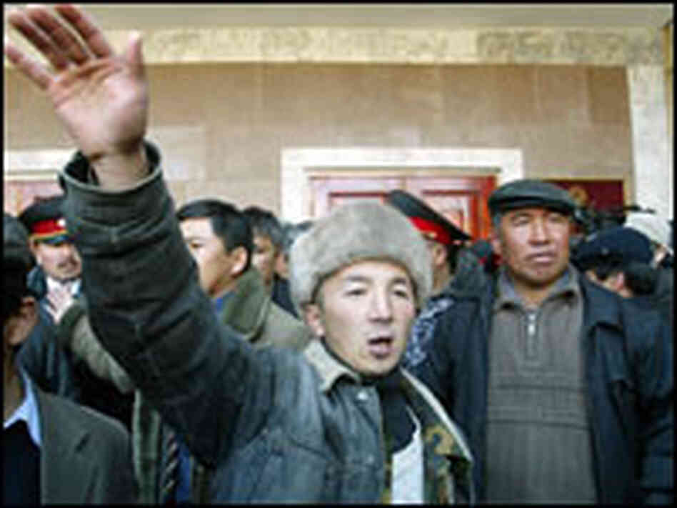 Protesters rally outside the parliament building in the capital of Bishkek Protesters rally outside the parliament building in the capital of Bishkek