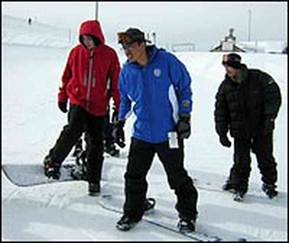 Minority students from Denver North High School take snowboarding lessons. Minority students from Denver North High School take snowboarding lessons.