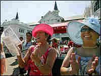 Race fans cheer at Churchill Downs Race fans cheer at Churchill Downs