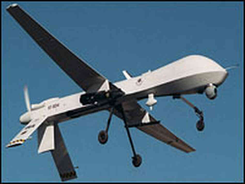 A Predator armed with an Hellfire missile flies a training mission. A Predator armed with an Hellfire missile flies a training mission.