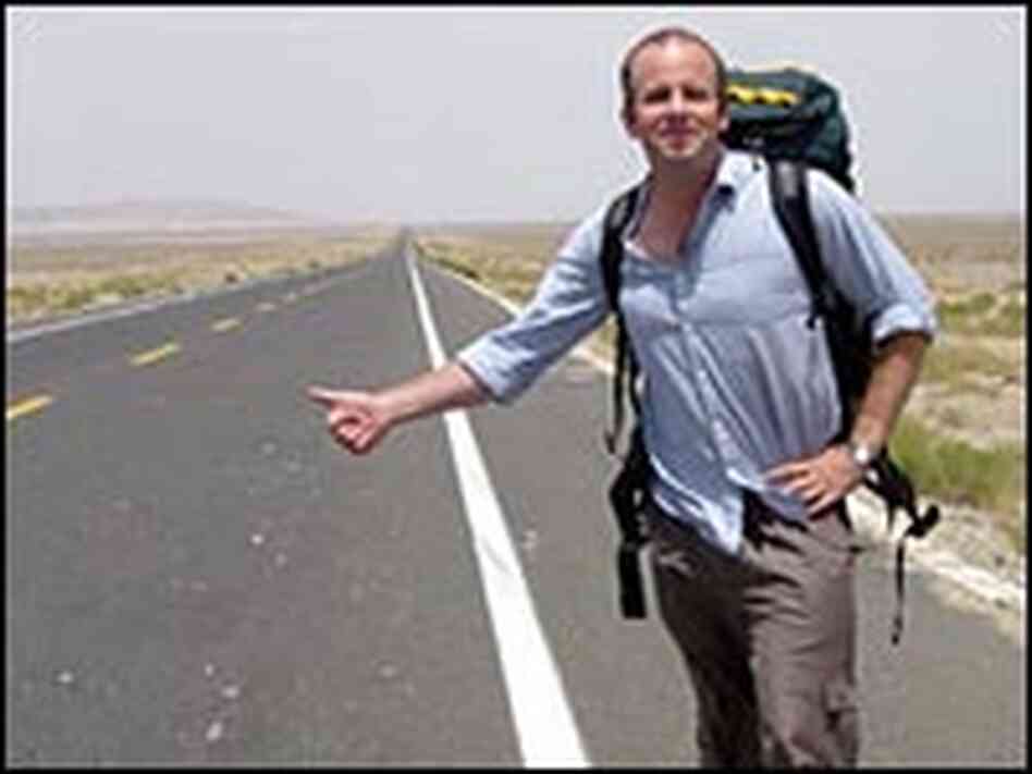 Rob Gifford hitchhikes on Route 312 in the Gobi Desert. Rob Gifford hitchhikes on Route 312 in the Gobi Desert.