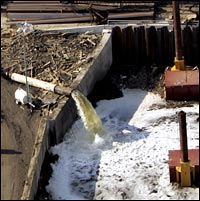 Crews work to pump water and repair a breached floodwall in New Orleans.