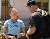 A Dublin, Ohio, police officer speaks to Charmaine Brown during a patrol in New Orleans.