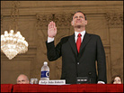John Roberts, chief justice nominee, raises his right hand as he is sworn in to testify. John Roberts, chief justice nominee, raises his right hand as he is sworn in to testify.