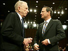Chief justice nominee John Roberts listens to Senate Judiciary Committee chairman Arlen Specter. Chief justice nominee John Roberts listens to Senate Judiciary Committee chairman Arlen Specter.
