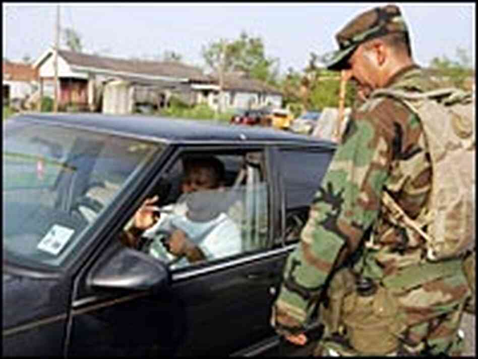 Guardsman hands out flyer to Louisiana resident Guardsman hands out flyer to Louisiana resident