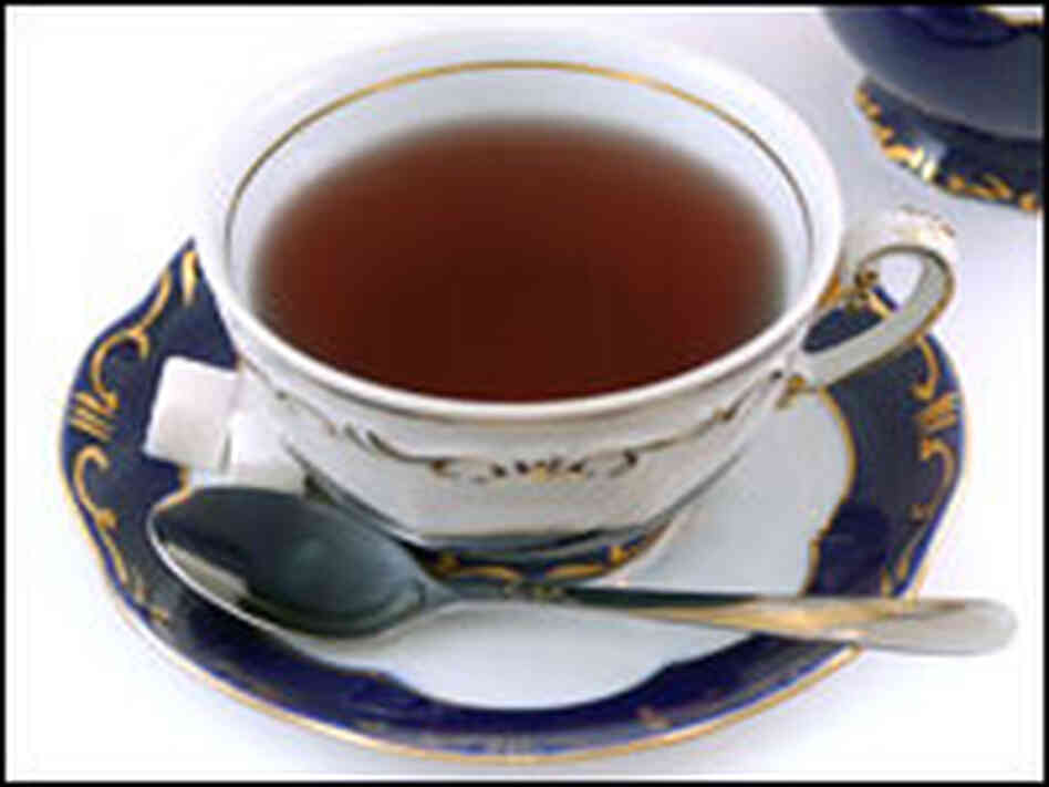 Teacup, spoon and sugar