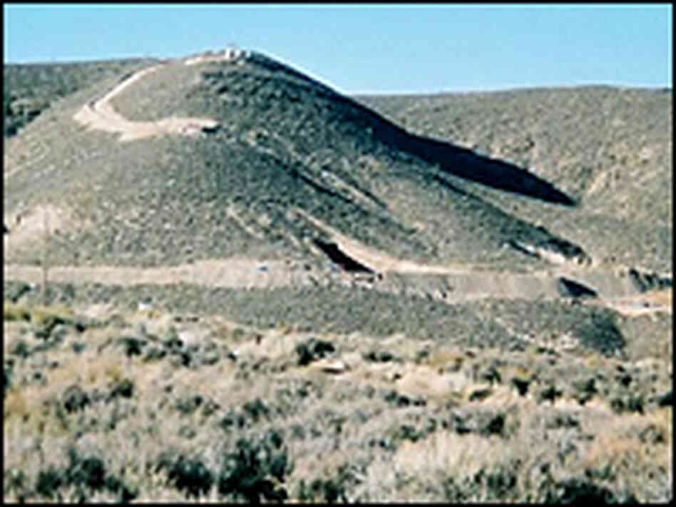 A tunnel in this hillside at the Nevada Test Site will be the home of a large bomb June 2. A tunnel in this hillside at the Nevada Test Site will be the home of a large bomb June 2.