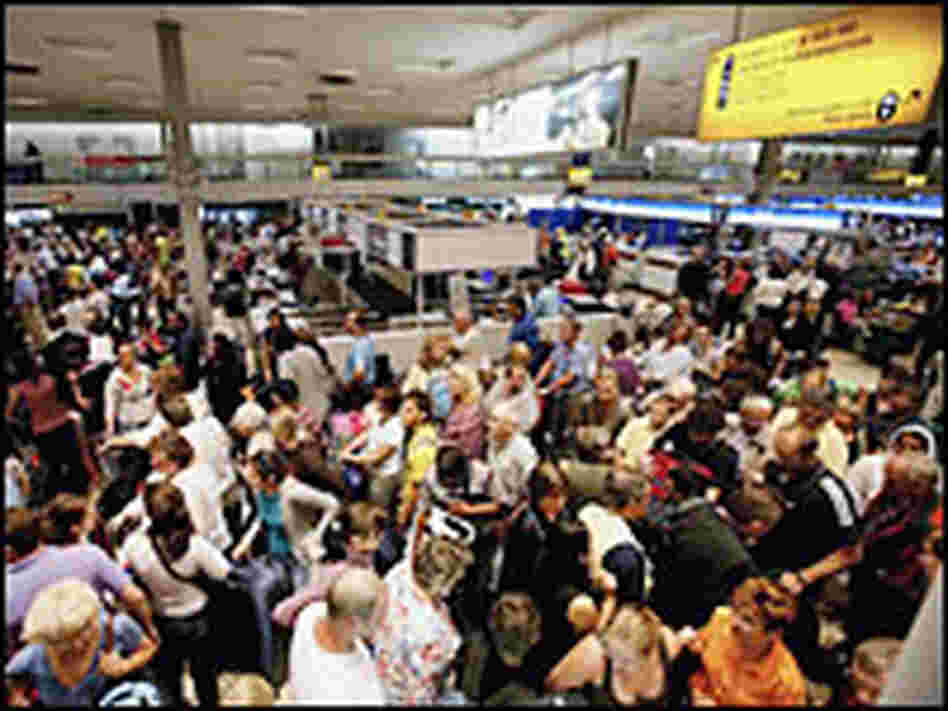 Passengers at London's Heathrow airport on Thursday. Credit: AP Photo/Kirsty Wigglesworth.