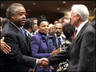 Rev. Al Sharpton shook hands with former President Jimmy Carter at a memorial service. Rev. Al Sharpton shook hands with former President Jimmy Carter at a memorial service.
