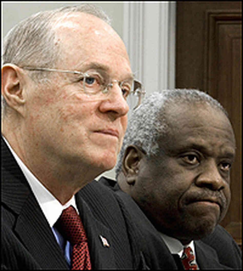 Supreme Court Justices Clarence Thomas and Anthony Kennedy.