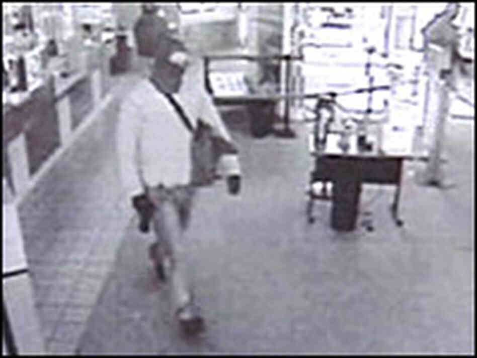 A surveillance camera captured this image of one of the gunmen A surveillance camera captured this image of one of the gunmen