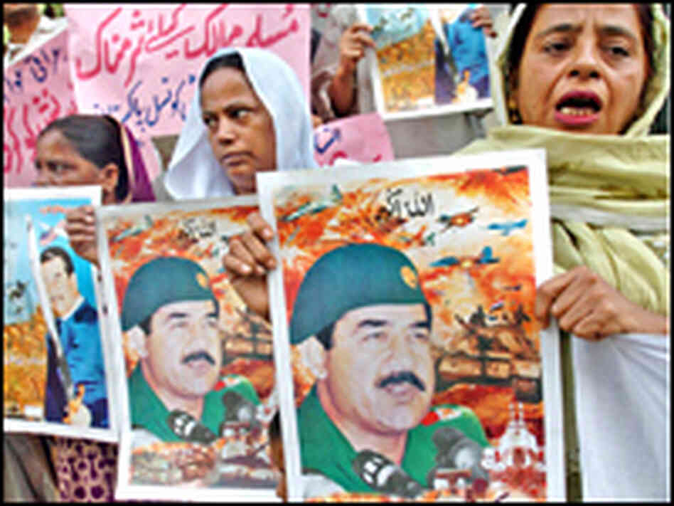 With Saddam Hussein's execution looming, Pakistani protesters shout slogans at a rally in Karachi. With Saddam Hussein's execution looming, Pakistani protesters shout slogans at a rally in Karachi.