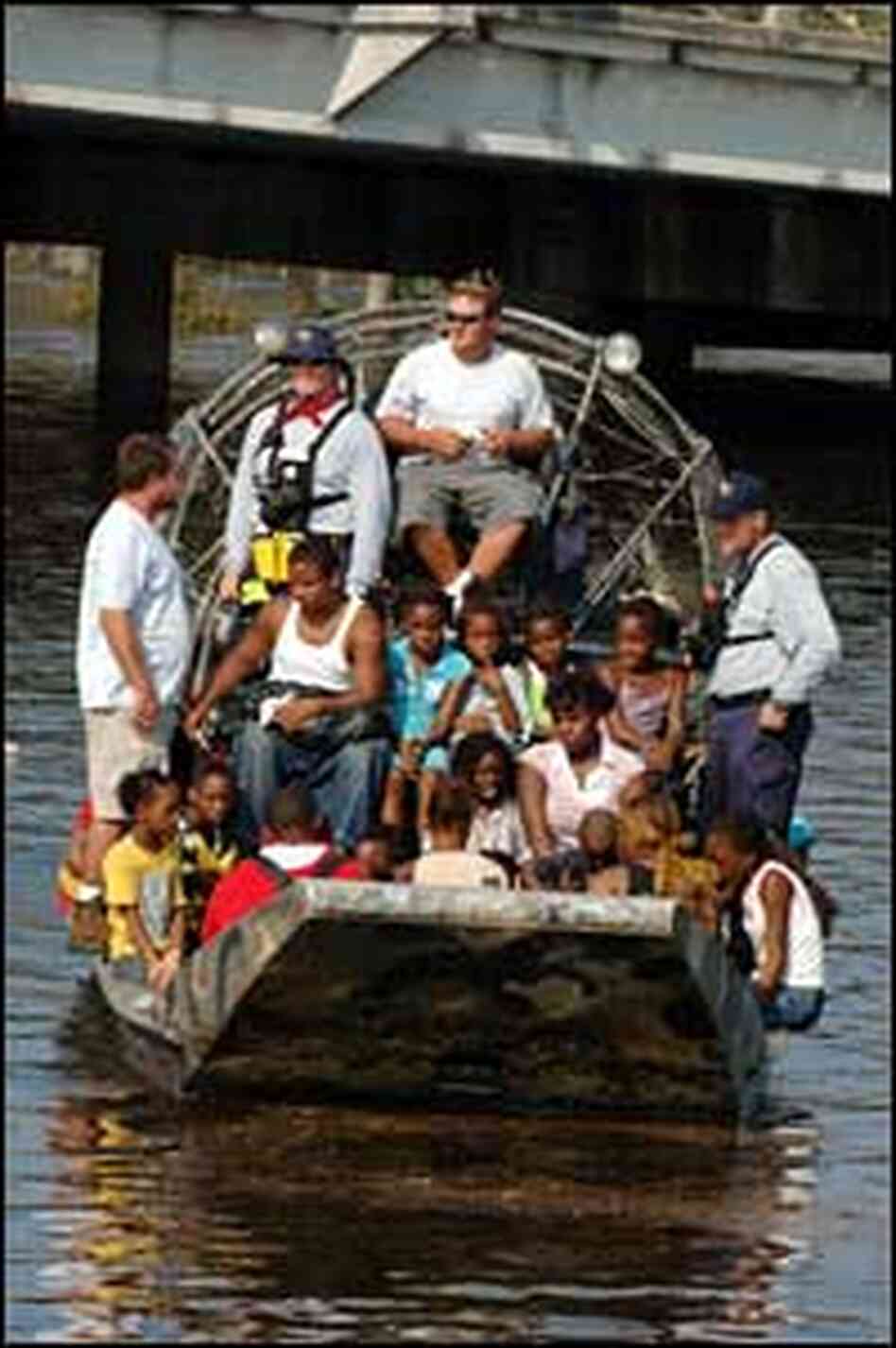 Residents are evacuated from their homes by a FEMA search and rescue team, Aug. 31, 2005. Residents are evacuated from their homes by a FEMA search and rescue team, Aug. 31, 2005.