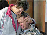 Betty Casto comforts her husband Earl inside the Sago Baptist Church in Tallmansville, W. Va., Betty Casto comforts her husband Earl inside the Sago Baptist Church in Tallmansville, W. Va.,