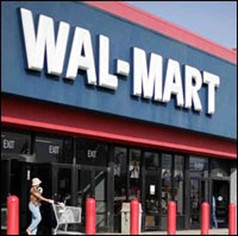 A customers leaves a Wal-Mart store in Clinton, Md. A customers leaves a Wal-Mart store in Clinton, Md.