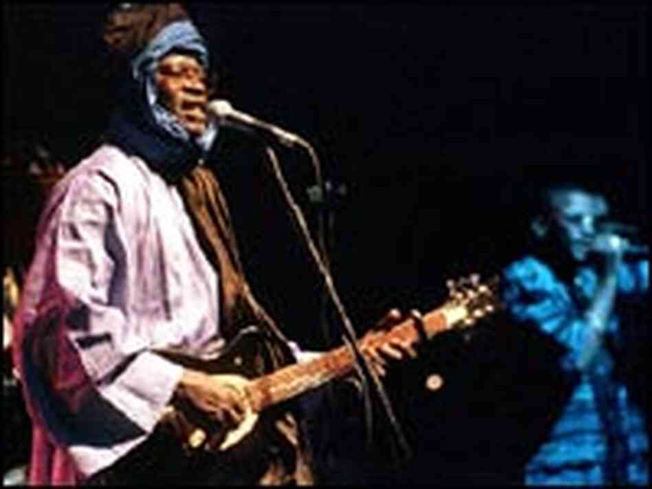 Ali Farka Toure performs with his band in Spain, July 15, 2000.