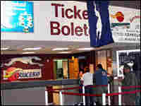 Travelers line up at the ticket both at the Greyhound station in Phoenix Travelers line up at the ticket both at the Greyhound station in Phoenix