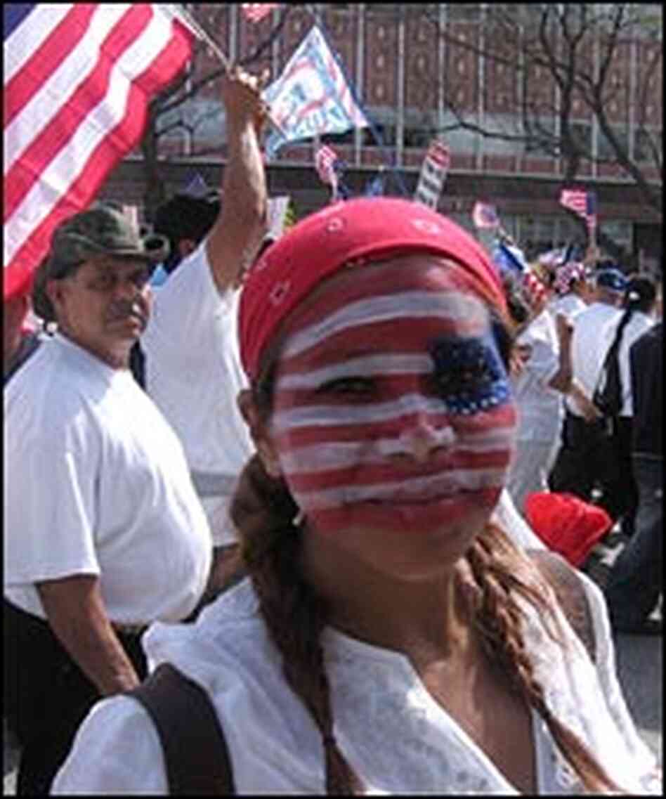 A protester in Los Angeles has her face painted as a U.S. flag. A protester in Los Angeles has her face painted as a U.S. flag.