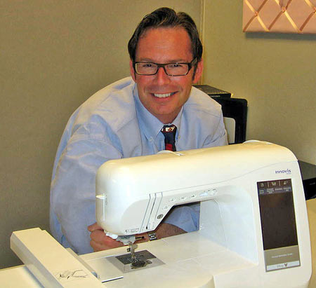 Dean Shulman of Brother International and the company's Innovis 5000D sewing machine.