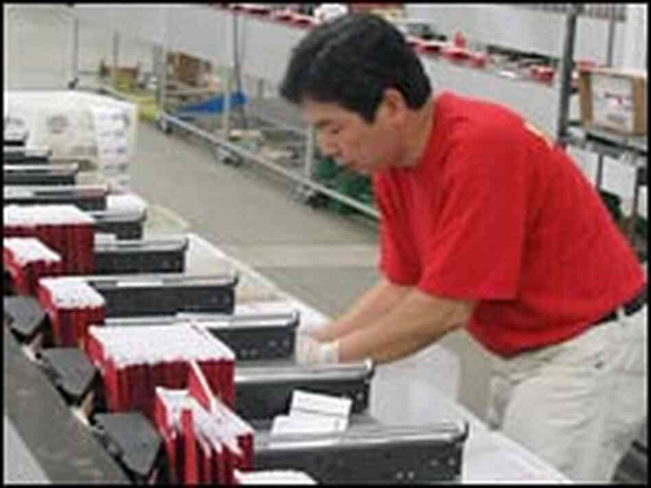 Machines at the Netflix distribution center in Santa Ana, Calif., sort DVD mailers by zip code.