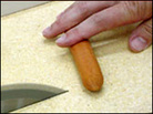 Almost there: A video grab shows a hot-dog in peril. Almost there: A video grab shows a hot-dog in peril.