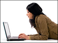 Girl using laptop computer.