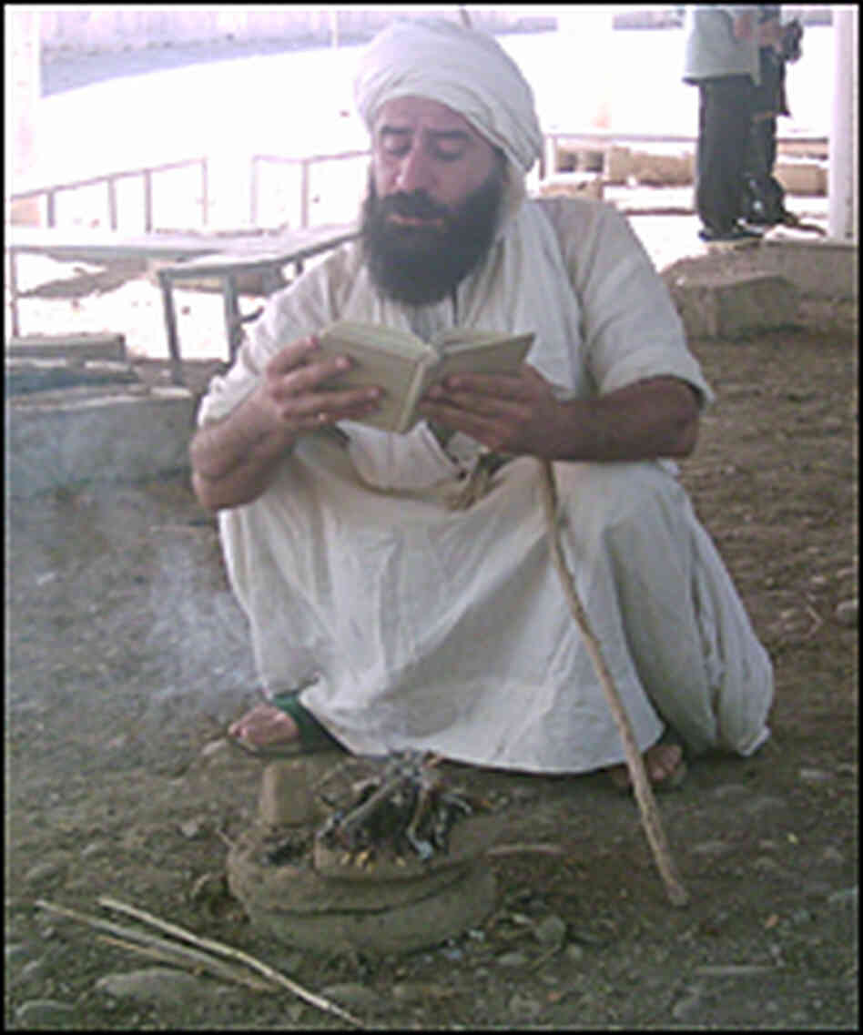 sheik reads during a ceremony sheik reads during a ceremony