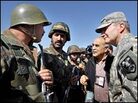 U.S. Lt. Gen. Karl Eikenberry talks with Afghan National Army soldiers. U.S. Lt. Gen. Karl Eikenberry talks with Afghan National Army soldiers.
